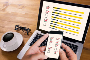image of checklists on a laptop and phone